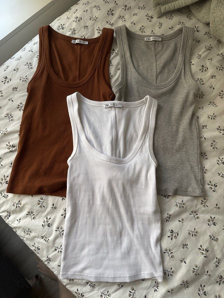 Zara Basic Tanks (Category: Sleeveless) located in Singapore. Submitted by feraluni (Listing ID 1371647050, Image 1). Description: Used once on a trip Bought in Paris Material is super soft and comfy Flattering on your figure too Tagged S, fits XS-M as there is stretch ONLY SELLING AS A SET Price is fixed Take all 3 for $45.