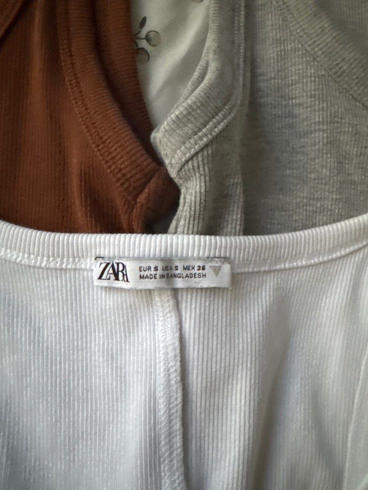 Zara Basic Tanks (Category: Sleeveless) located in Singapore. Submitted by feraluni (Listing ID 1371647050, Image 3). Description: Used once on a trip Bought in Paris Material is super soft and comfy Flattering on your figure too Tagged S, fits XS-M as there is stretch ONLY SELLING AS A SET Price is fixed Take all 3 for $45.