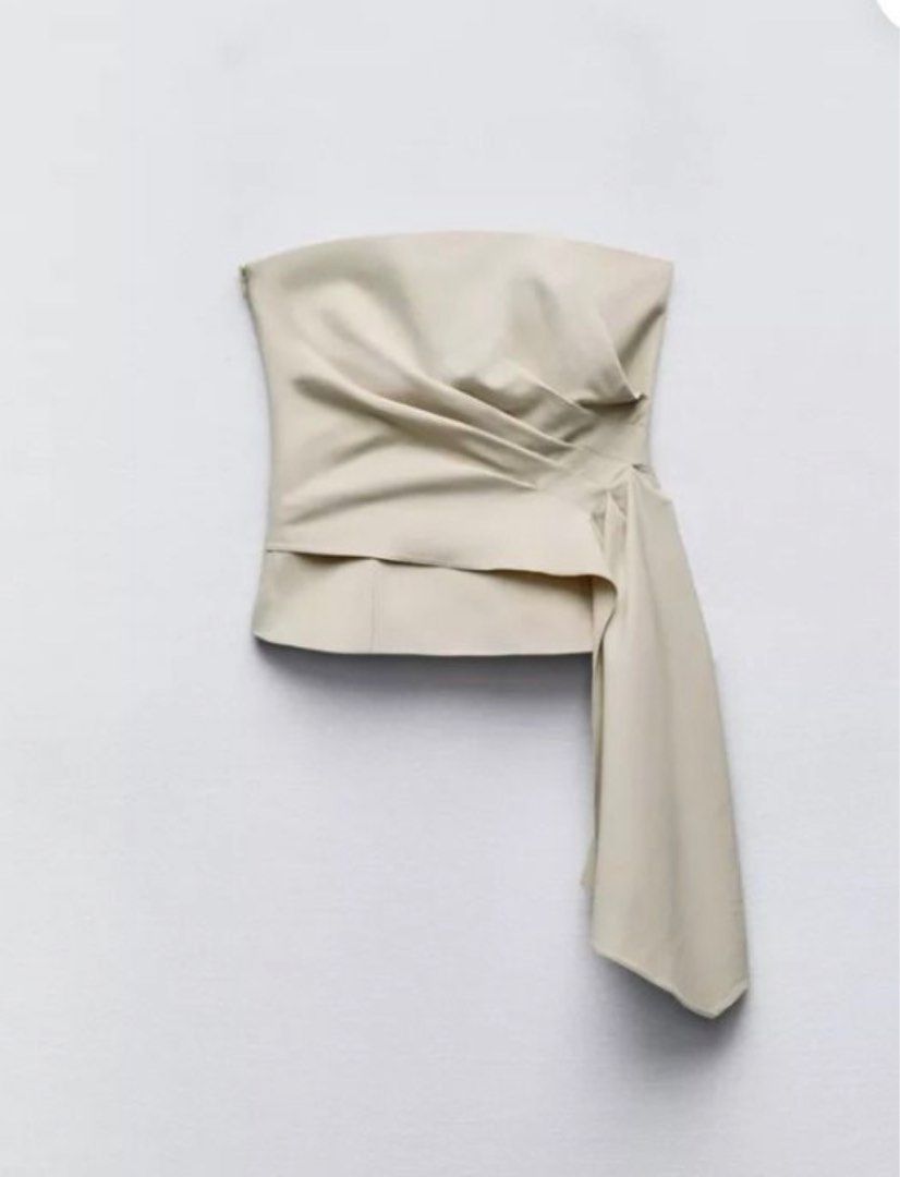 Zara Beige Bustier Tube Top (Category: Others Tops) located in Paete. Submitted by arria.j (Listing ID 1371581238, Image 1). Description: - Zara Cream Beige Bustier Top - Draped fabric on the side - Contrast lining - Invisible side zip fastening (.5 inch cut stitch on the zipper, not visible since sa inner siya) - altered on the back - used only once - bought from store! Original top price: 2995 .