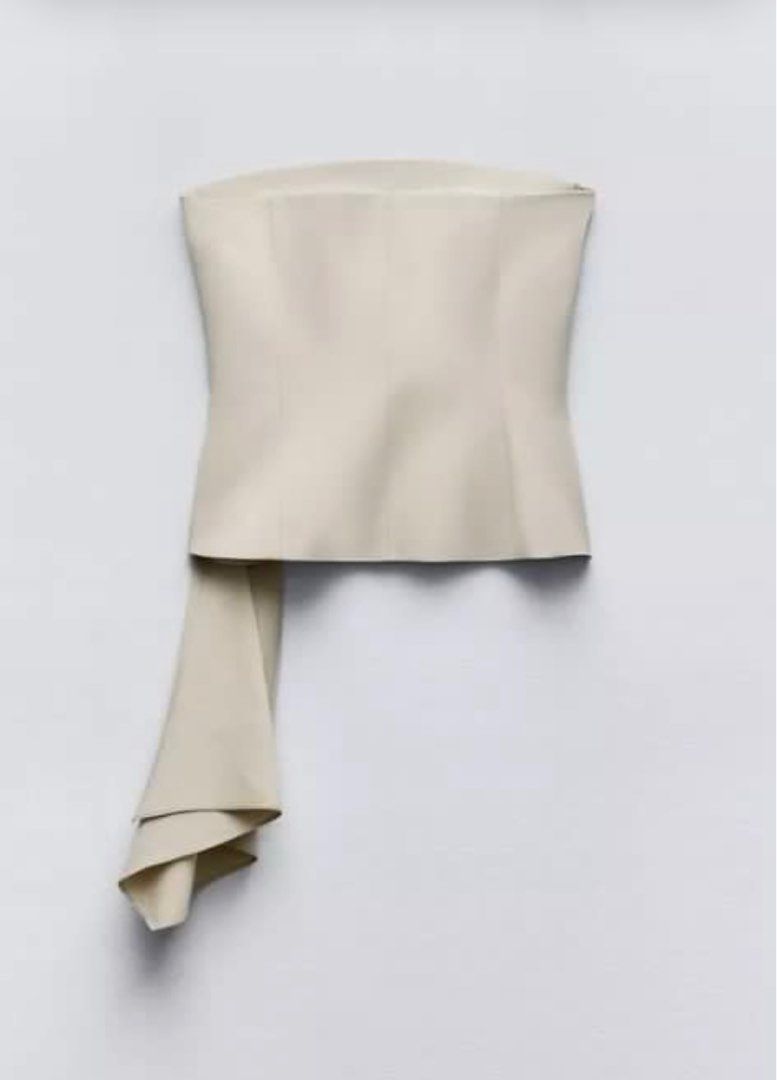 Zara Beige Bustier Tube Top (Category: Others Tops) located in Paete. Submitted by arria.j (Listing ID 1371581238, Image 2). Description: - Zara Cream Beige Bustier Top - Draped fabric on the side - Contrast lining - Invisible side zip fastening (.5 inch cut stitch on the zipper, not visible since sa inner siya) - altered on the back - used only once - bought from store! Original top price: 2995 .