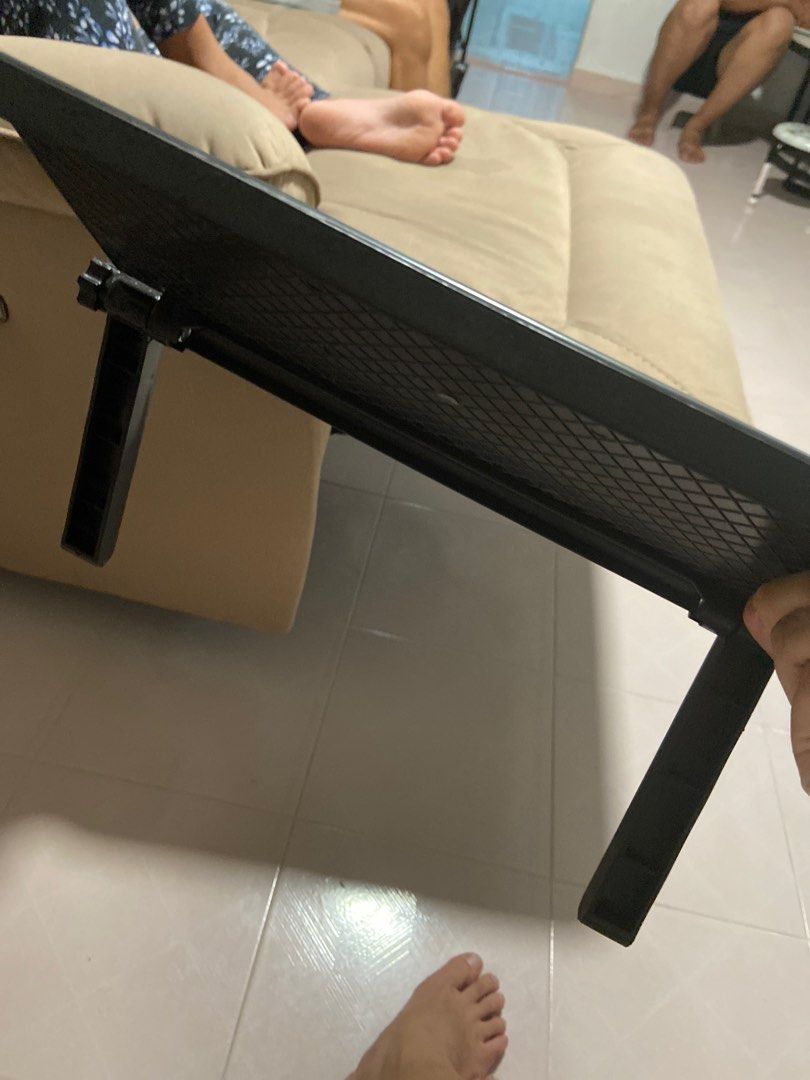 Adjustable Black Laptop Stand (Category: Laptop Bags & Sleeves) located in Singapore. Submitted by alyahmad (Listing ID 1371856734, Image 2). Description: This is a brand new laptop stand. It's black and adjustable, so you can set it to your preferred height. It looks like it's still in its original packaging, so it's in perfect condition. It's a great way to improve your posture and make your workspace more ergonomic. It's also a space-saving so