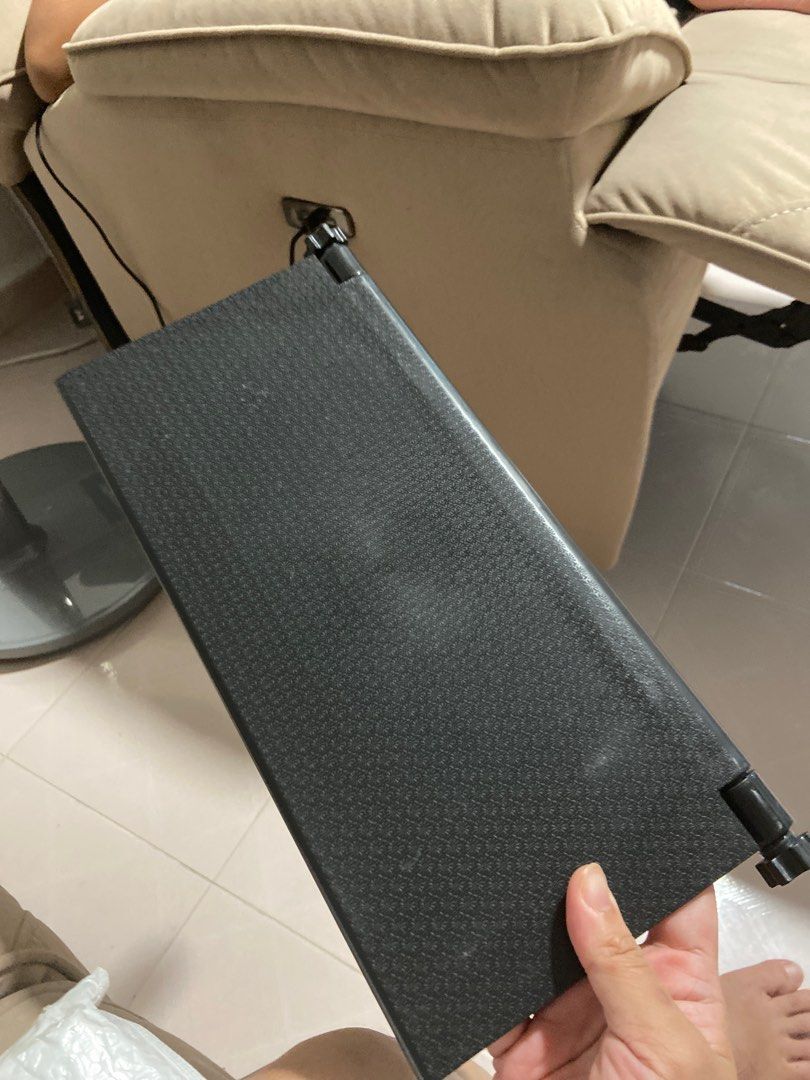 Adjustable Black Laptop Stand (Category: Laptop Bags & Sleeves) located in Singapore. Submitted by alyahmad (Listing ID 1371856734, Image 1). Description: This is a brand new laptop stand. It's black and adjustable, so you can set it to your preferred height. It looks like it's still in its original packaging, so it's in perfect condition. It's a great way to improve your posture and make your workspace more ergonomic. It's also a space-saving so