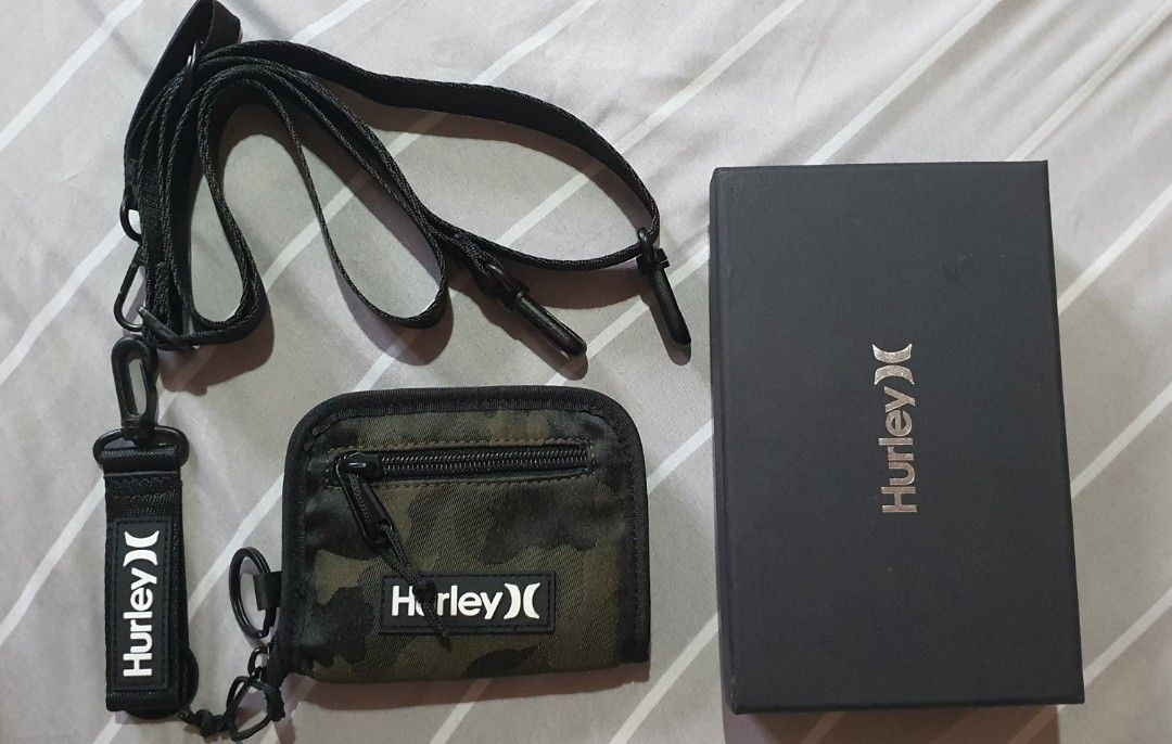 Hurley canvas 2 way wallet with strap (removable) (Category: Luxury Bags & Wallets) located in Makati City. Submitted by kaecee. (Listing ID 1371820928, Image 1). Description: Hurley canvas 2 way wallet with strap and key holder (removable).