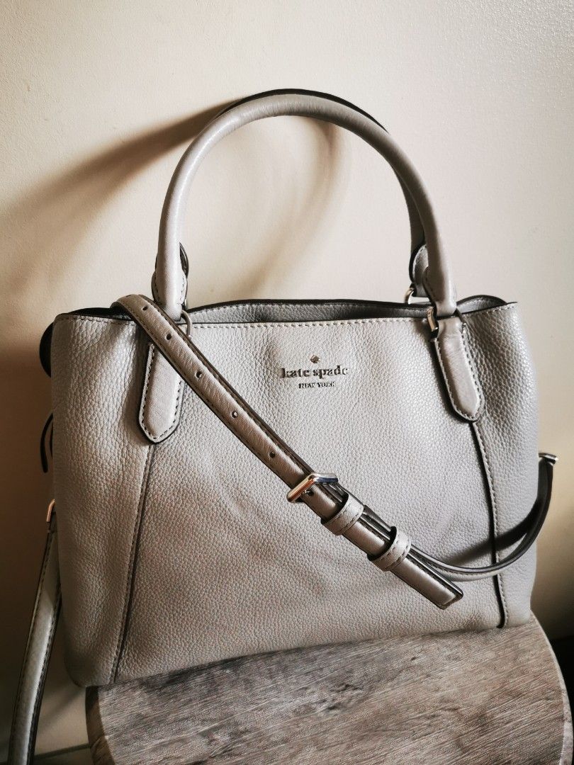 Kate spade shoulder bag (Category: Luxury Bags & Wallets) located in Makati City. Submitted by photosgadez79399 (Listing ID 1371805098, Image 1). Description: 100%authentic Kate Spade Jackson Triple compartment bag Color light gray Pebbled leather exterior Two way spade jacquard lining Zip & snap closure Double handles & detable straps Size: 8.3"h x 11.4"w x 4.9"d Drop length 22" Handle drop 5" Condition: 9/10 Used only a few times Dust bag not i