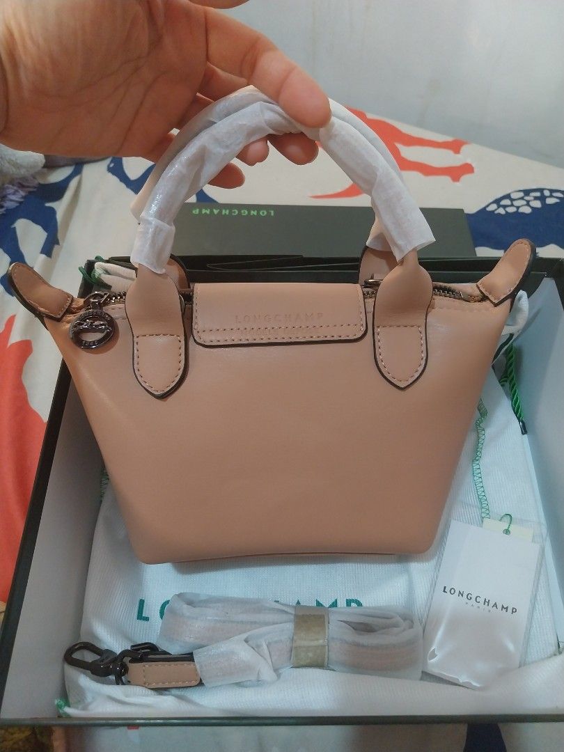 LONGCHAMP Leather Small Shoulder Bag (Category: Shoulder Bags) located in Quezon City. Submitted by jonvee2000 (Listing ID 1371882727, Image 2). Description: Brand new with box paper bag / dustbag leather/nude in color small.