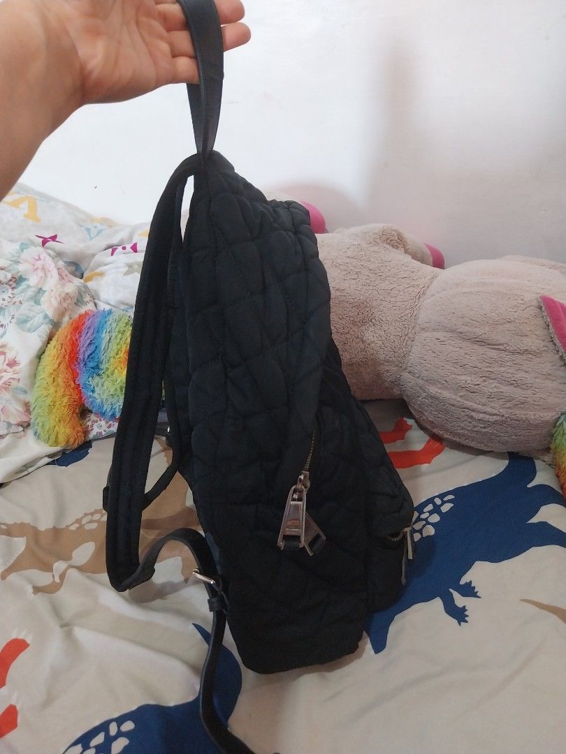 MOSCHINO Quilted Backpack (Category: Backpacks) located in Quezon City. Submitted by jonvee2000 (Listing ID 1371776203, Image 2). Description: My Very Preloved bag ykk zipped very comfy backpack for me sign of usage in handle and mostly in leather material, but still can be used for a long time.
