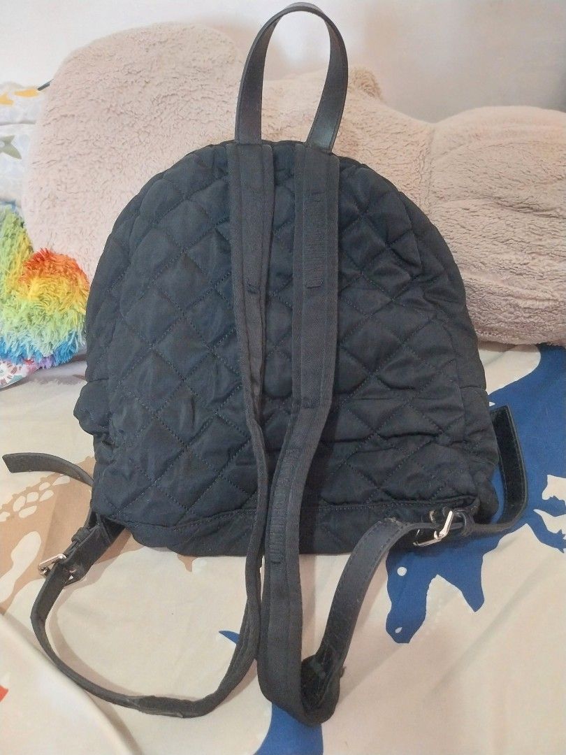 MOSCHINO Quilted Backpack (Category: Backpacks) located in Quezon City. Submitted by jonvee2000 (Listing ID 1371776203, Image 3). Description: My Very Preloved bag ykk zipped very comfy backpack for me sign of usage in handle and mostly in leather material, but still can be used for a long time.