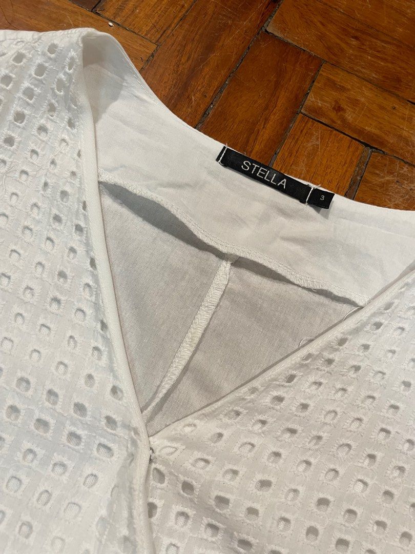 White Eyelet Wrap Top (Category: Blouses) located in Quezon City. Submitted by mnl.declutter (Listing ID 1371764506, Image 3). Description: White Eyelet Wrap Top •in great condition •used once only •eyelet part not see through •bought in department store Size guide •width ≈ 19.5 in •length ≈ 18 in •sleeve length ≈ 10.5 in DM for any questions or inquiries! 😊 MOP - Gcash SF - c/o buyer.
