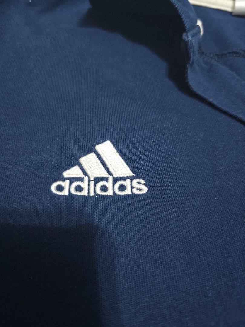 Adidas Real Madrid (Category: Activewear) located in Singapore. Submitted by k3n7_louy (Listing ID 1367032713, Image 3). Description: Adidas Real Madrid collared Shirt, with detailed club crest and Adidas logo and three stripes. This top is a few years old but is a quailty top. Not worn much as a little too small for me. Cheap price for a quick sale..