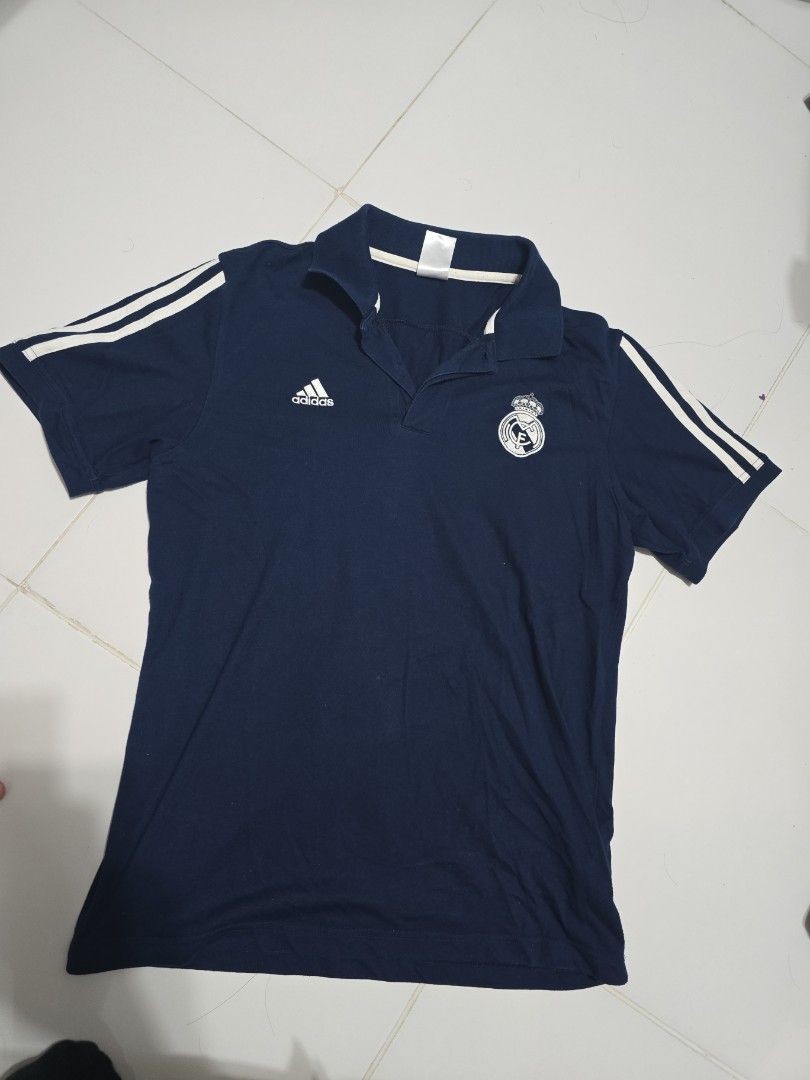 Adidas Real Madrid (Category: Activewear) located in Singapore. Submitted by k3n7_louy (Listing ID 1367032713, Image 1). Description: Adidas Real Madrid collared Shirt, with detailed club crest and Adidas logo and three stripes. This top is a few years old but is a quailty top. Not worn much as a little too small for me. Cheap price for a quick sale..
