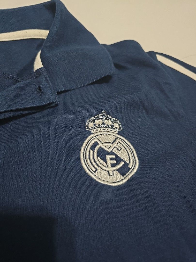 Adidas Real Madrid (Category: Activewear) located in Singapore. Submitted by k3n7_louy (Listing ID 1367032713, Image 2). Description: Adidas Real Madrid collared Shirt, with detailed club crest and Adidas logo and three stripes. This top is a few years old but is a quailty top. Not worn much as a little too small for me. Cheap price for a quick sale..