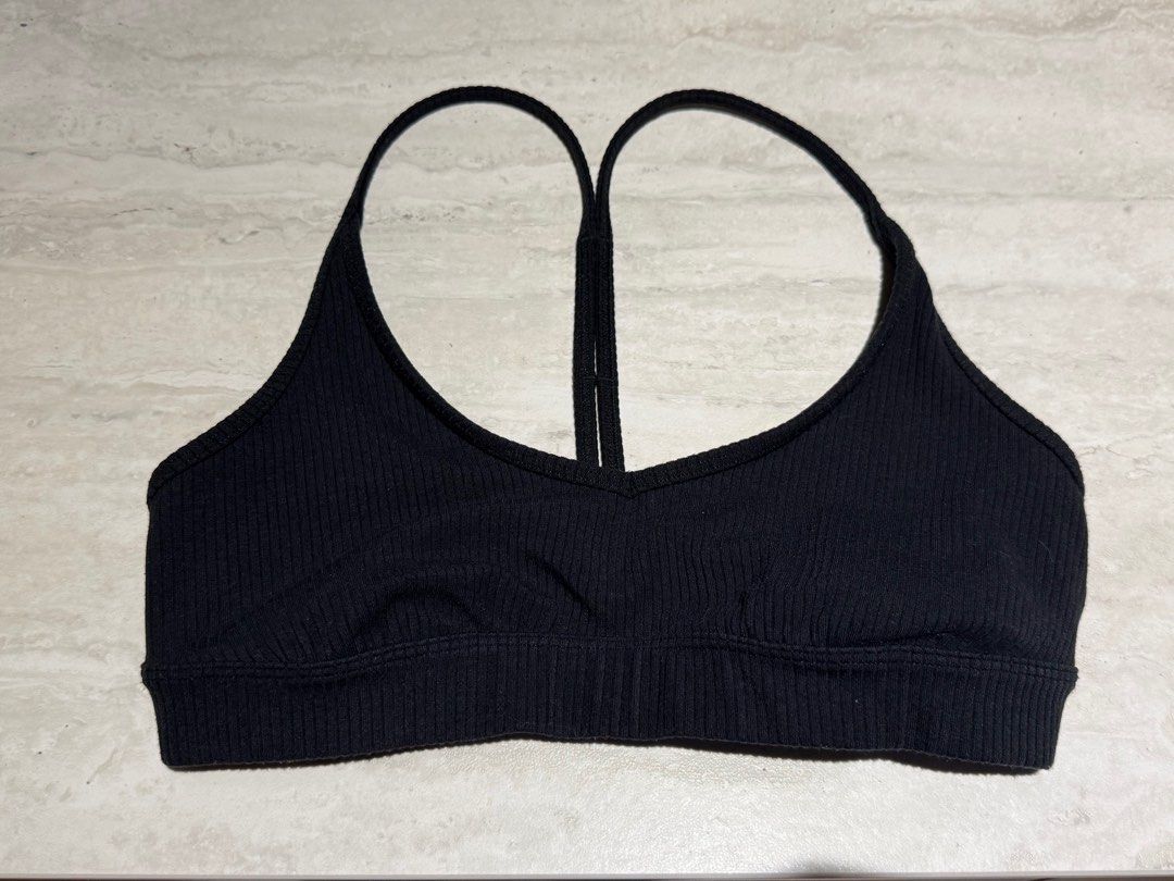 Alo Yoga BLACK Bra (Category: Activewear) located in Singapore. Submitted by dotreesmind (Listing ID 1366740238, Image 3). Description: Alo Yoga Blissful Bra Colour: Black Size: S Condition: New without tags. Please note care label cut off. Detail: Ribbed material with sexy Y straps detailing for the back. Removable cups insert, no padding provided..