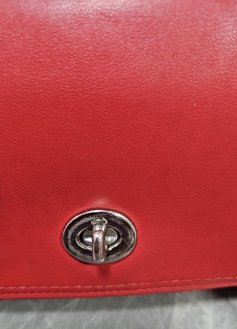 Coach Legacy Penny Crossbody Bag (Category: Luxury Bags & Wallets) located in Antipolo. Submitted by jlaur26 (Listing ID 1367014697, Image 2). Description: Authentic coach penny legacy crossbody bag in red color. Some issues sa hardware (pls see photos). torn na rin yung tag but it's there sa loob ng bag. 😅 Creed is intact. rfs: decluttering. price slightly negotiable. delivery fee to be shouldered by buyer..