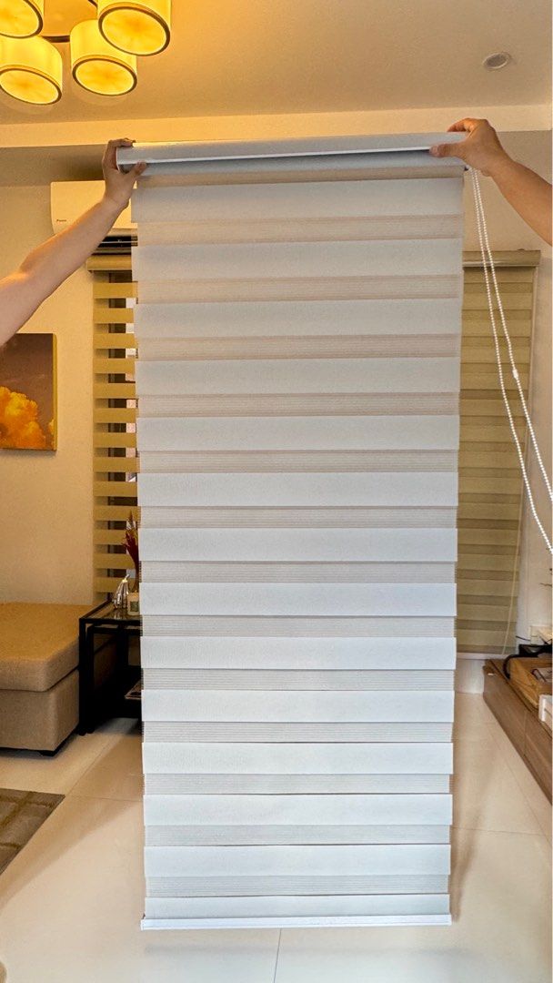Curtain Blinds (Category: Curtains & Blinds) located in Quezon City. Submitted by 2ndtake (Listing ID 1366935562, Image 2). Description: Curtain blinds. White. 3 pieces. Never used because we changed color. Complete. Ready to install. Well kept. 3rd picture is how it will look like. (74cm x 200cm).