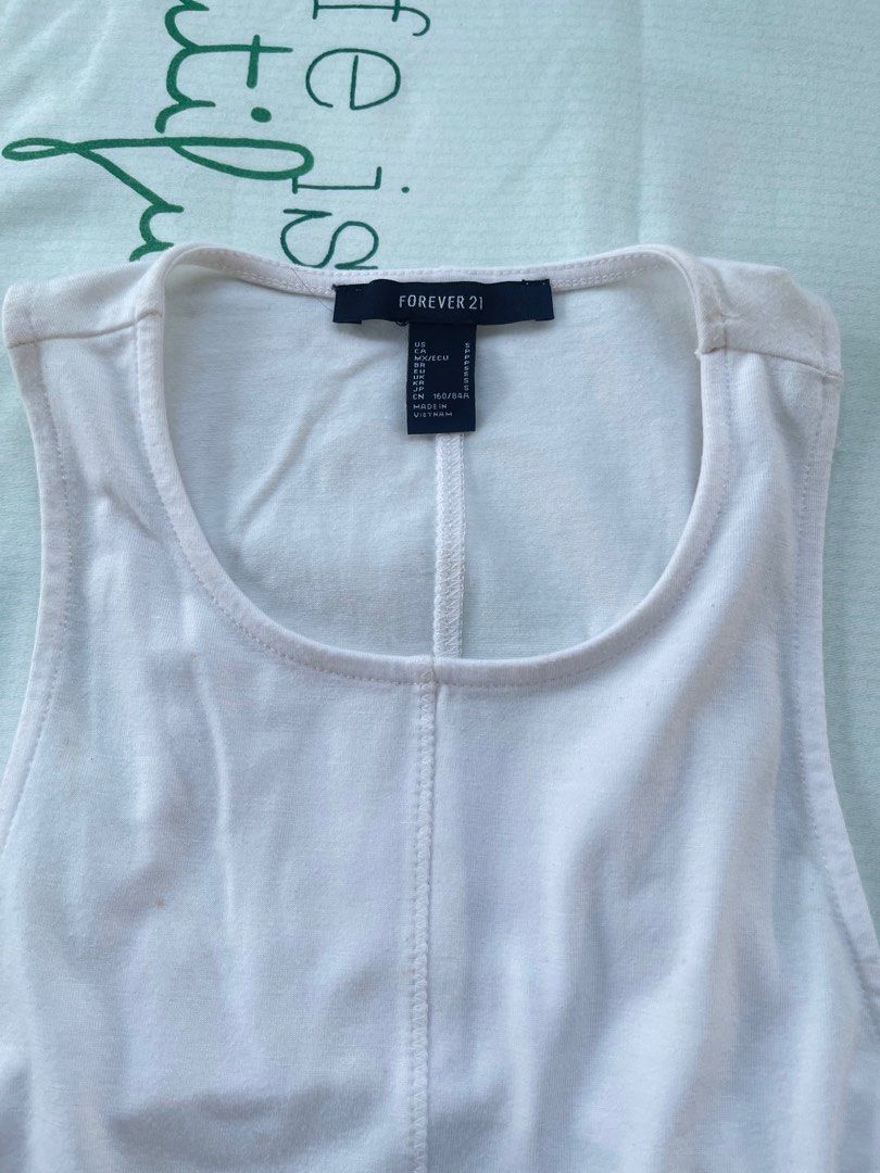 Forever 21 White Cotton Top with Back Cut Out (Small) (Category: Sleeveless) located in Rizal. Submitted by skymunch (Listing ID 1367055992, Image 1). Description: Have small stain (see last picture) Stain can be removed after washing Payment methods: Gcash, BPI 📌 Color may vary due to lighting 📌 Item needs washing 📌 No cancellation.