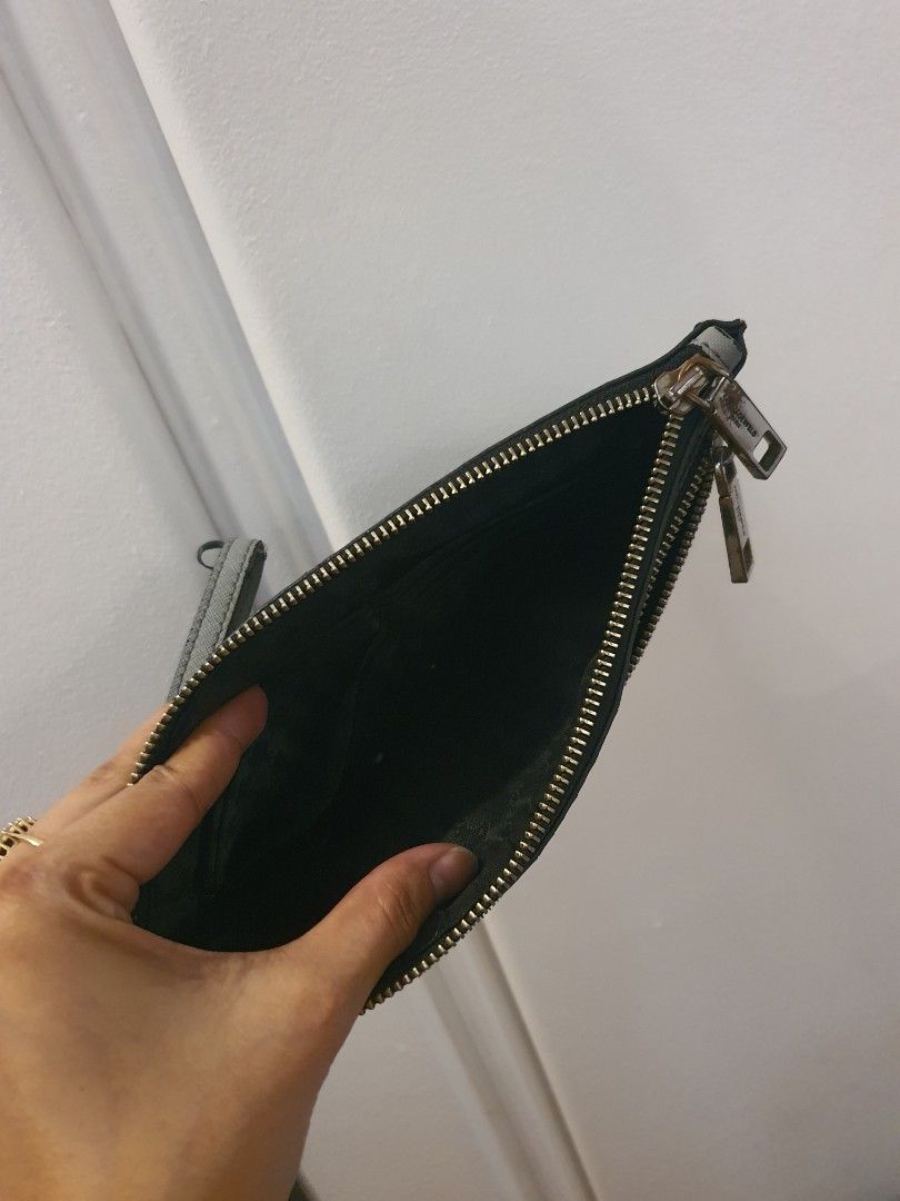 Karl Lagerfeld Paris Large Wristlet (Category: Wallets & Card holders) located in Marilao. Submitted by dlane (Listing ID 1366975676, Image 3). Description: Di na po ginamit since nagka baby. Na stock na lang sya. Barely used din sya before. See actual photos for some signs of usage. Ang ganda pa super kaya lang need to let go na for some cabinet space..