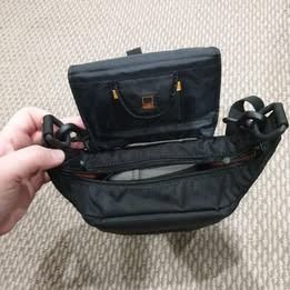 Lowepro Compact Courier 80 - fits small DSLRs, Instax cameras, etc (Category: Others) located in Parramatta. Submitted by starbacon (Listing ID 1367006891, Image 2). Description: Compact camera bag - purchased a while ago for around $150. Has been barely used - ended up getting a different bag after purchasing and never ended up using it for anything else. Has a removable section that fastens to your camera, zip closure, a pouch for spare memory 