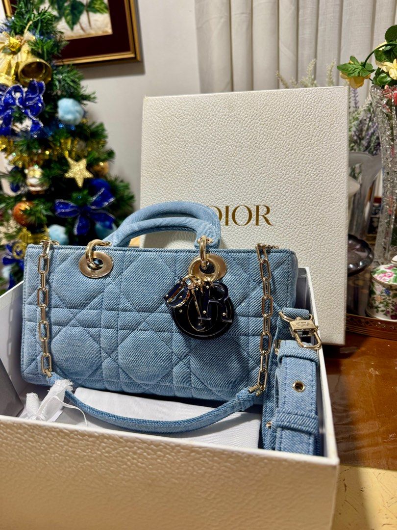 Medium Denim Cannage Lady Djoy 2022 (Category: Luxury Bags & Wallets) located in Cavite. Submitted by carrycouturebymsu (Listing ID 1367058676, Image 2). Description: • Features a quilted denim body, flat denim top handles, a detachable flat denim strap, a top flap closure and an interior slip pocket • Champagne GHW • Color denim blue (coded) • Actual pic posted (No additional photos) • What you see is what you get Measurement : Depth - 16 cm Wid