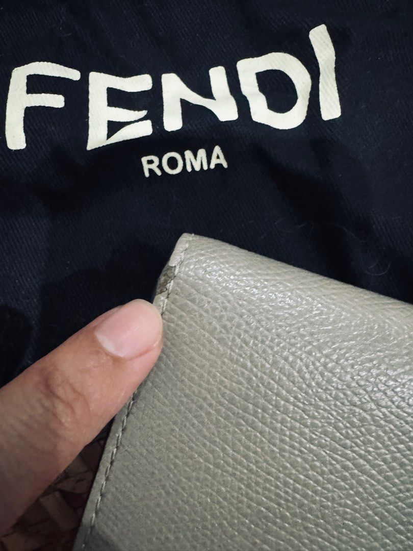 Original Fendi Bifold wallet (Category: Luxury Bags & Wallets) located in Taguig. Submitted by lordfriedrich (Listing ID 1367065450, Image 3). Description: Original price: php 25,000 Bought it in fendi store at greenbelt 100% money back guarantee if proven fake Downsizing my collection Color: light gray/very light beige Flaw: a small scratch With pouch and paperbag Price is negotiable.