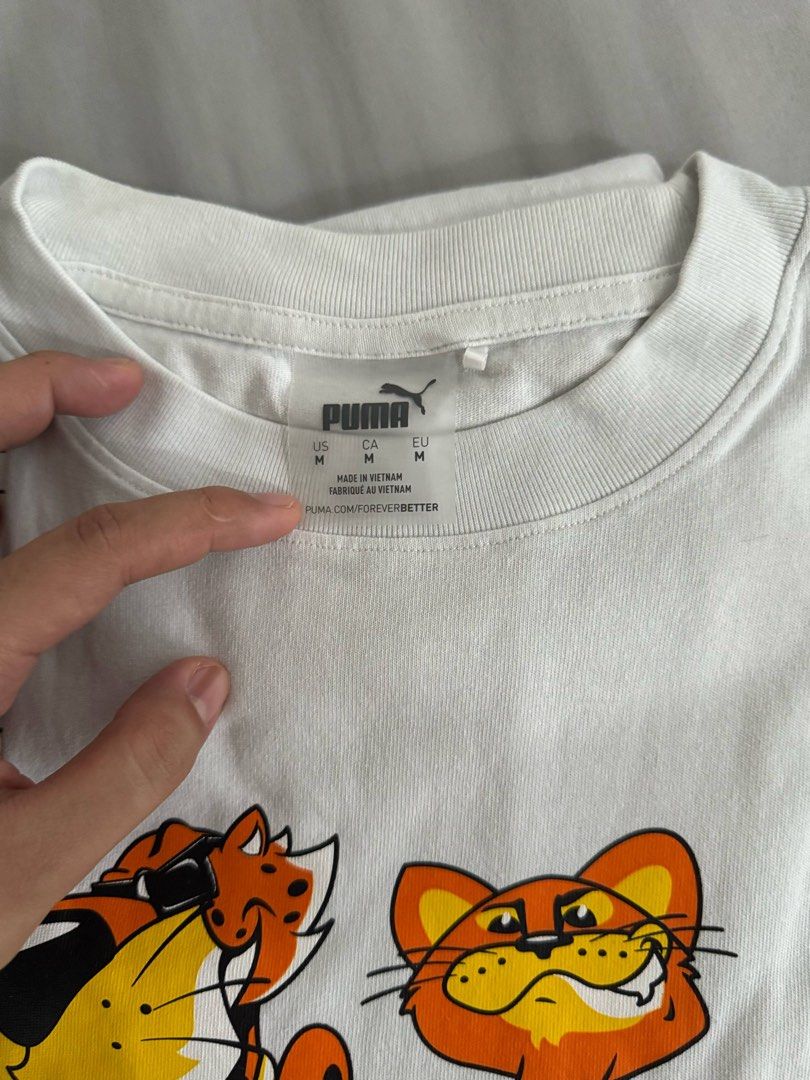 PUMA HOOPS x CHEETOS Tee (Category: Tshirts & Polo Shirts ) located in Quezon City. Submitted by kimmychi23 (Listing ID 1366977831, Image 2). Description: PUMA HOOPS x CHEETOS Tee Size: medium (relaxed fit) Condition: 10/10 looks new and no flaws Bought for: ₱2900 at Puma Store Selling because: Decluttering Feel free to message me for more photos or questions!.