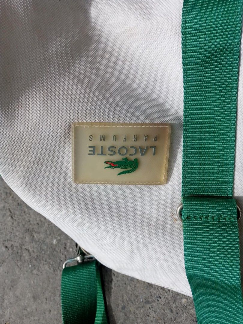 Vintage Lacoste Duffle bag (Category: Luxury Bags & Wallets) located in Manila. Submitted by vintagethrifter29 (Listing ID 1366919464, Image 2). Description: measurements 14 top to bottom 29 width left to right issue Yung mga bakal na part may mga minimal na kalawang maalis pa Naman kung magaling ka mag tanggal all in good condition 😊 message me for more info.