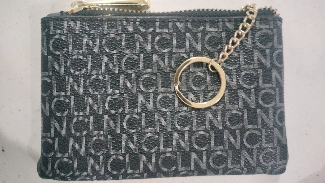 CLN Coin purse Wallet (Category: Wallets & Card holders) located in Manila. Submitted by rinroo (Listing ID 1372003008, Image 2). Description: MPO CLN Wallet RFS: decluttering Flaws: rubs on leather edge of zipper (QS SEEN ON PICTURE) PLEASE READ ME -looks good as new except for the rub as seen on the pic (pics are is) - smooth gold zipper - gold keyring inside - slot for card (can fit two) - fits folded bills and coins comes with styro filler, d