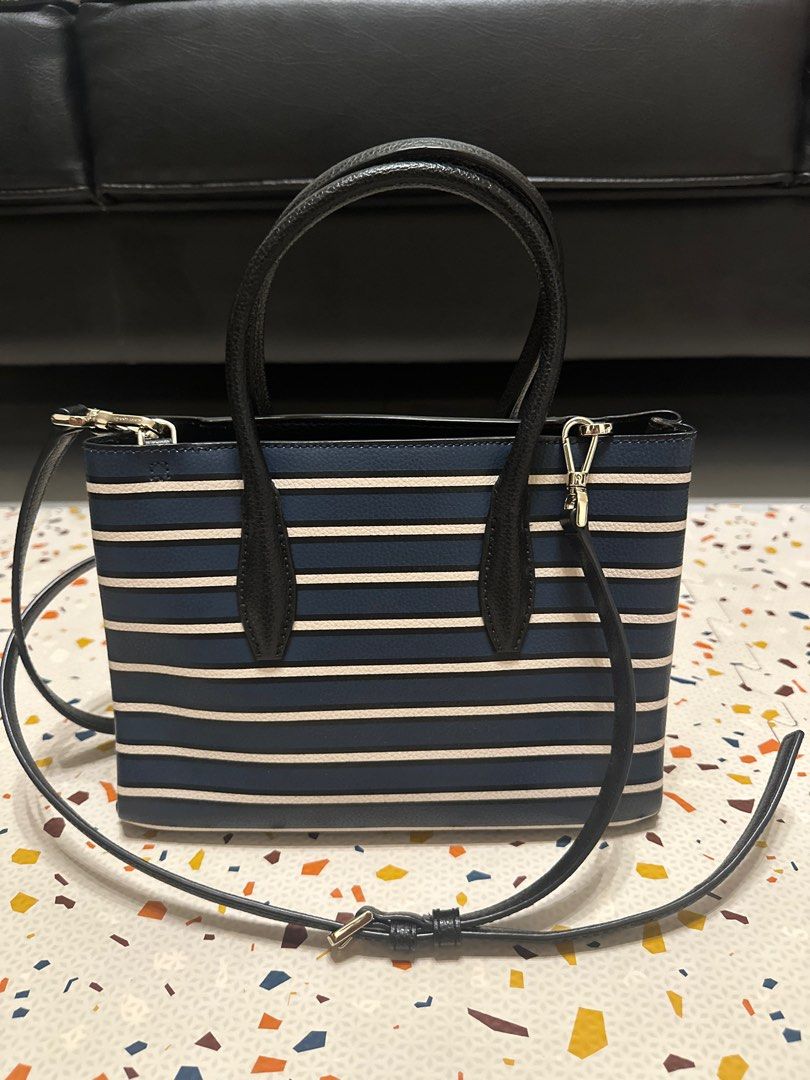 Eva Stripe Small Top Zip Satchel (Category: Luxury Bags & Wallets) located in Manila. Submitted by choychoy06 (Listing ID 1371990800, Image 2). Description: SIZE 7.6”h x 9.6”w x 4.5”d drop length: 22” handle drop: 5” MATERIAL 7.6”h x 9.6”w x 4.5”d drop length: 22” handle drop: 5” satchel with zip closure interior slide pocket foil embossed logo dust bag not included imported Style No. WKRU6123.