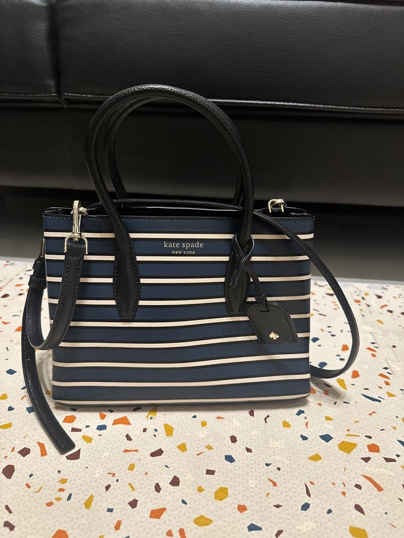 Eva Stripe Small Top Zip Satchel (Category: Luxury Bags & Wallets) located in Manila. Submitted by choychoy06 (Listing ID 1371990800, Image 1). Description: SIZE 7.6”h x 9.6”w x 4.5”d drop length: 22” handle drop: 5” MATERIAL 7.6”h x 9.6”w x 4.5”d drop length: 22” handle drop: 5” satchel with zip closure interior slide pocket foil embossed logo dust bag not included imported Style No. WKRU6123.