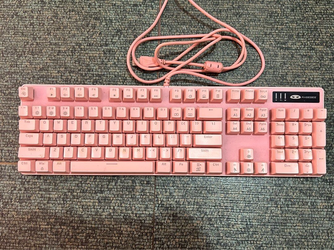 Magegee Mechanical Keyboard (Category: Computer Keyboard) located in Makati City. Submitted by peanutbutterjelly_ (Listing ID 1371932540, Image 1). Description: MAGEGEE PINK MECHANICAL KEYBOARD 🩷 used for 9 months 🩷 wire length - 1.6m; keyboard size - 44*13*3.8cm; keyboard weight - 1250g 🩷 blue switch 🩷 flaws: needs cleaning & there are 2 keys which require a firmer press to register RFS: no longer used ⚠️ NO RETURN, NO REFUND, NO EXCHANGE PO