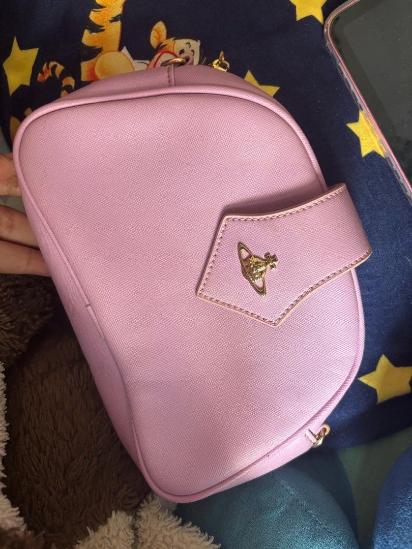 vivienne westwood pink pouch (Category: Luxury Bags & Wallets) located in Bulacan. Submitted by smrssl.1 (Listing ID 1372012582, Image 1). Description: still hearing offers !!.
