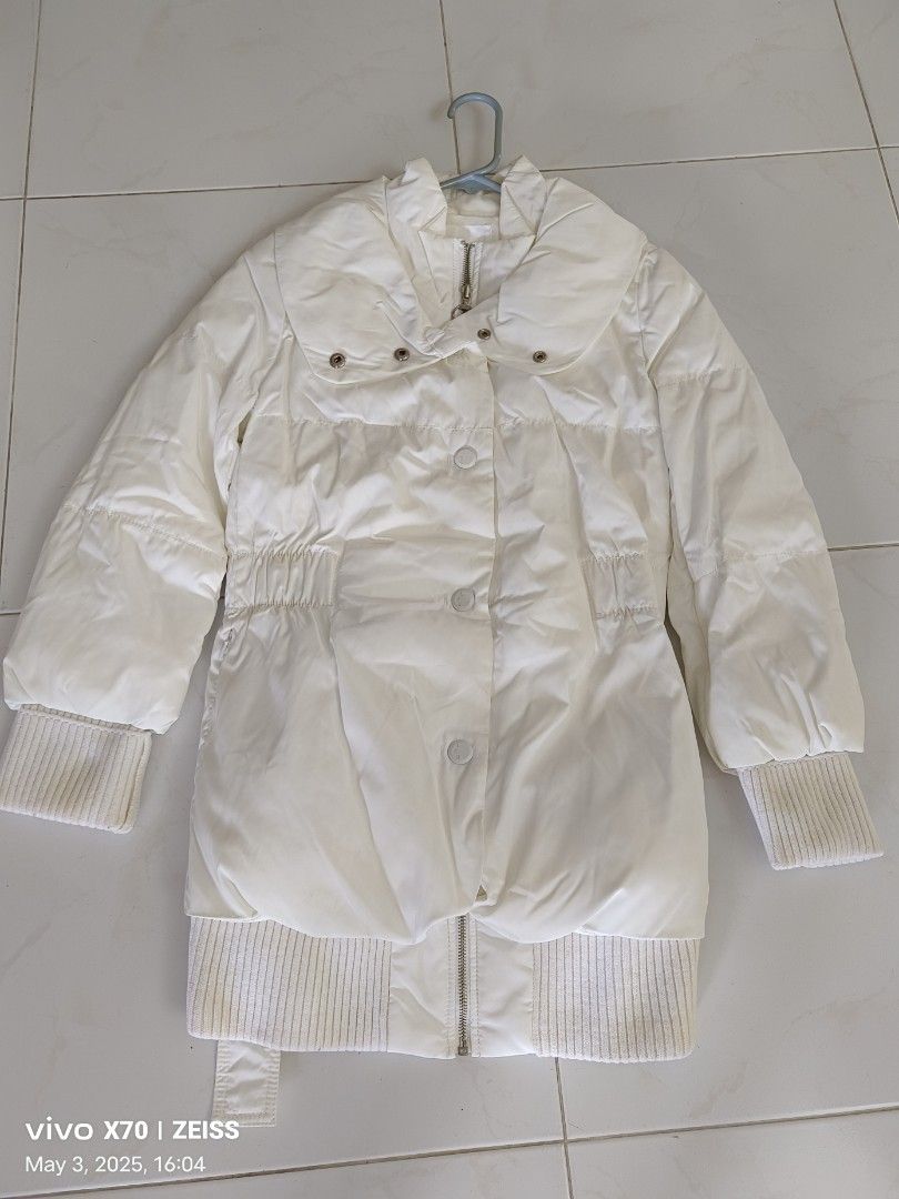 Winter Jacket (Category: Coats, Jackets and Outerwear) located in Singapore. Submitted by cheerfully0124 (Listing ID 1372014928, Image 2). Description: Pure white colour of lady winter Jacket with two sides pockets in front can be zip up and button on. No yellowish spot (see to believe) it was purchased from overseas seldom used.