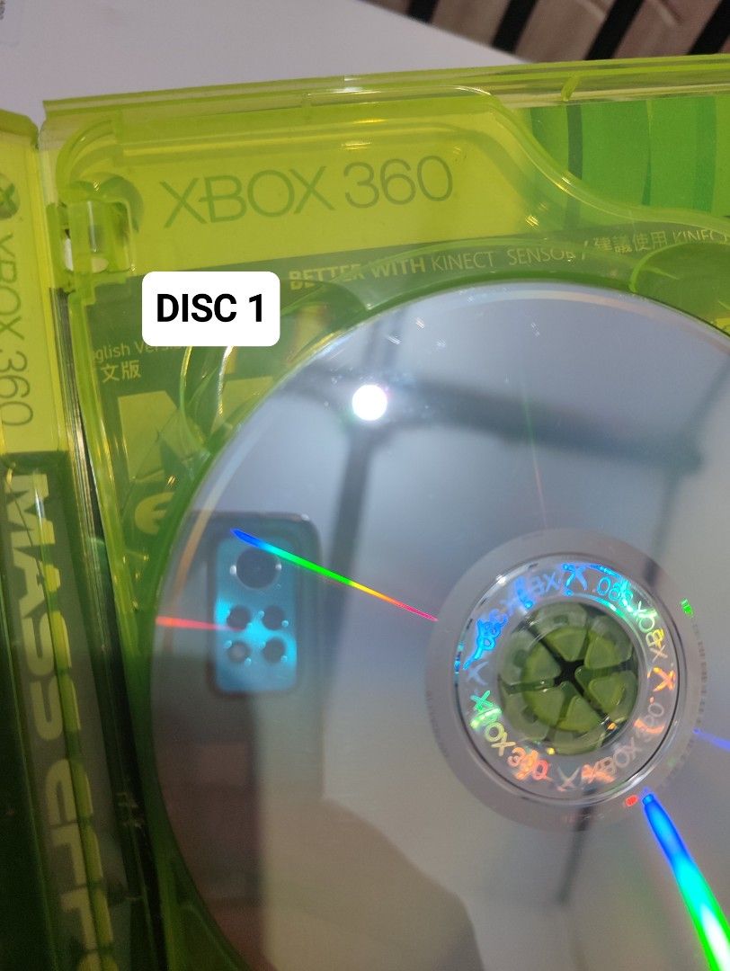 XBOX 360 - Mass Effect 2 (PRE-OWNED) "OPEN REGION" (Category: Xbox) located in Mendez-Nunez. Submitted by sf2_gameshop (Listing ID 1372021053, Image 3). Description: PLEASE READ: Open region, the disc will work on any Xbox 360 units. PAL - √ (Yes) NTSC/J - √ (Yes) NTSC/UC - √ (Yes) CONDITION: Pre-owned item.Tested working. The case has dents and damage in the plastic cover (see photos). GENRE: Action role-playing, third person shooter MODE: Singl