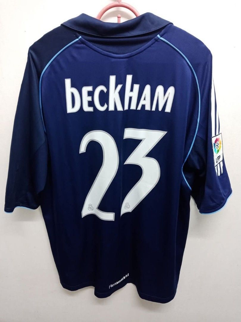 #23 David Beckham 2005-06 Real Madrid soccer/football jersey/kit rare/retro/vintage (Category: Activewear) located in Singapore. Submitted by dreamsstore (Listing ID 1372229487, Image 1). Description: #23 David Beckham 2005-06 Real Madrid jersey !! Jersey in a very good condition for its age ! SIZE : M ❗️❗️❗️ Pit : 20-21 inches Length : 28 inches FREE POSTAGE INCLUDED FOR ALL SHIRTS🎉🎉🎉 Some bobbling is expected for retro jerseys but conditions