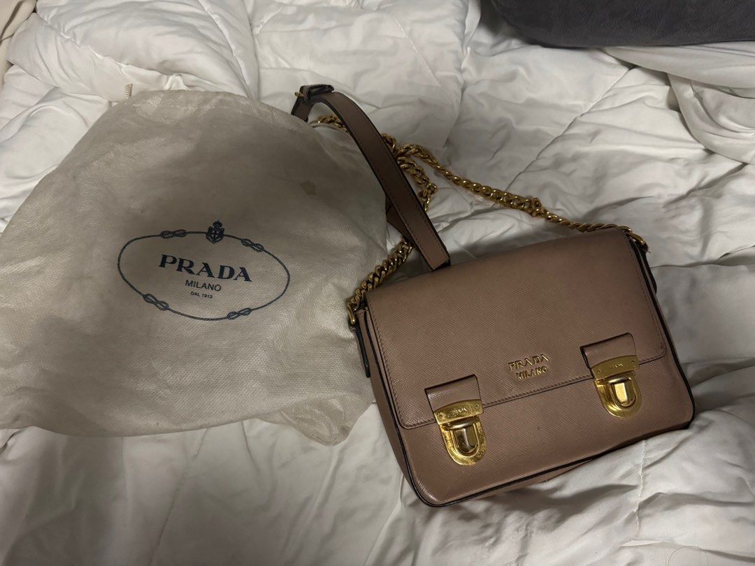 Authentic Prada saffiano shoulder bag (Category: Luxury Bags & Wallets) located in San Juan City. Submitted by prelovedloot (Listing ID 1372121606, Image 1). Description: Selling low because this is in need of a bag spa/cleaning. Bought at €1000 from a luxury personal shopper in Italy. Well loved. 🩷.