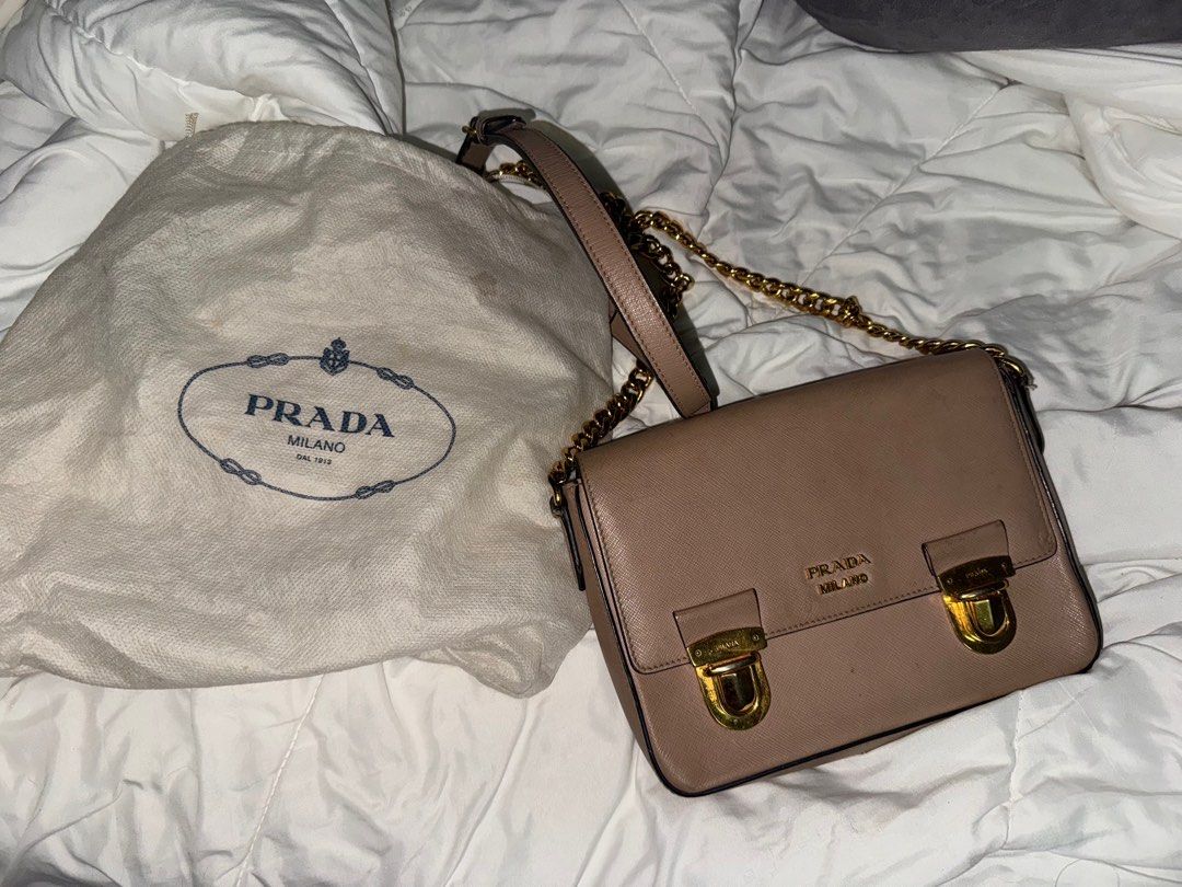 Authentic Prada saffiano shoulder bag (Category: Luxury Bags & Wallets) located in San Juan City. Submitted by prelovedloot (Listing ID 1372121606, Image 2). Description: Selling low because this is in need of a bag spa/cleaning. Bought at €1000 from a luxury personal shopper in Italy. Well loved. 🩷.