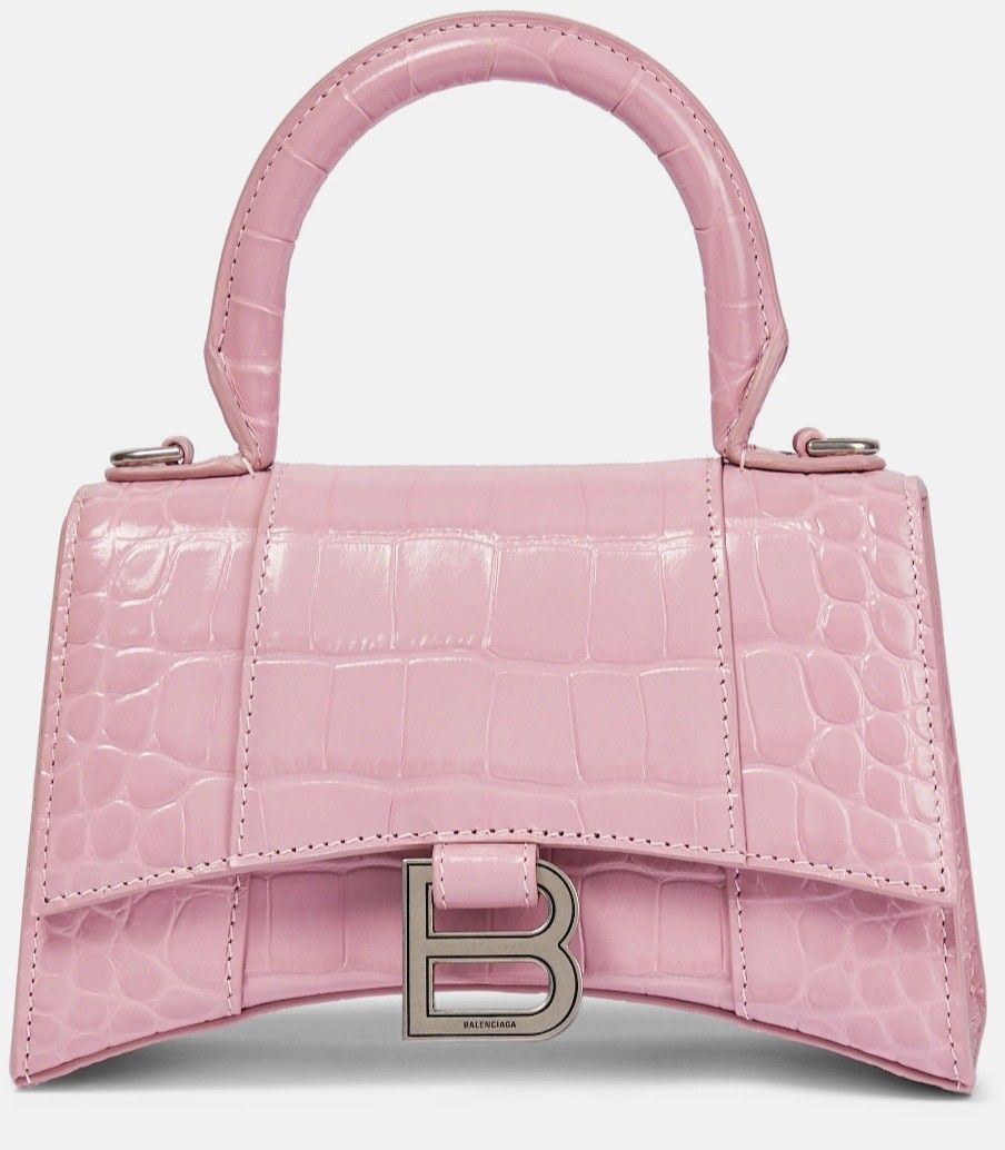 Balenciaga (Category: Bags & Wallets) located in Singapore. Submitted by rrandomic (Listing ID 1372089701, Image 1). Description: - Balenciaga Horglass - Sakura pink -Size small - Comes with dust bag, box, paperbag, and entrupy cert - Some minor stains and discolouration in the interior of the bag. Otherwise, the interior is generally clean. - No significant scratches on logo - Other minor defects are marked in the photos. - Will be able to provi