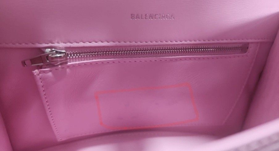 Balenciaga (Category: Bags & Wallets) located in Singapore. Submitted by rrandomic (Listing ID 1372089701, Image 3). Description: - Balenciaga Horglass - Sakura pink -Size small - Comes with dust bag, box, paperbag, and entrupy cert - Some minor stains and discolouration in the interior of the bag. Otherwise, the interior is generally clean. - No significant scratches on logo - Other minor defects are marked in the photos. - Will be able to provi