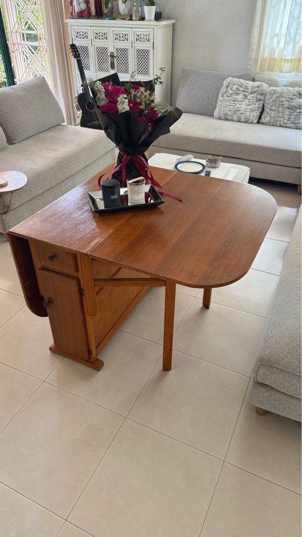 Folding Table (Category: Tables & Sets) located in Singapore. Submitted by tamaw (Listing ID 1372111170, Image 3). Description: Restored character folding table originally from London. Has cupboard and draws in the centre part. Great for tight spaces and compact living. 150cm Fully Extended (length) 40cm Folded (length) 87cm wide 74 cm Height.