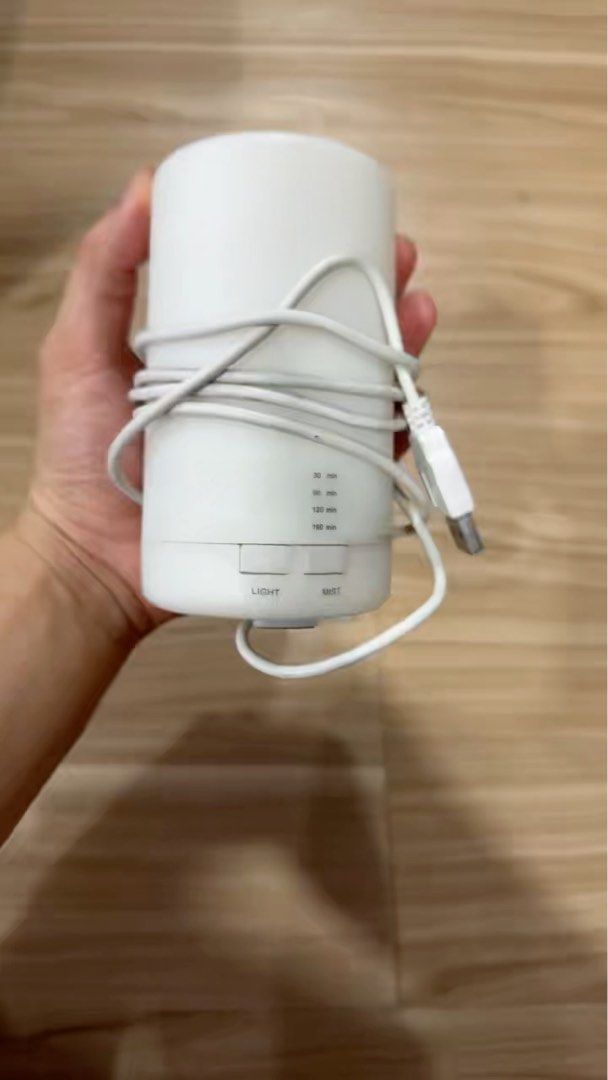 Mini USB Diffuser MINISO (Category: Home Fragrance) located in Singapore. Submitted by smartyshirt (Listing ID 1372222301, Image 1). Description: Selling a mini USB diffuser. It's white and has a USB cable. It has a light and mode button. It has a capacity of 60, 120, and 180 minutes. It's in good condition, and it's been well used. It's a great addition to any room, and it's perfect for aromatherapy. It's easy to use and clean. It's a great way 