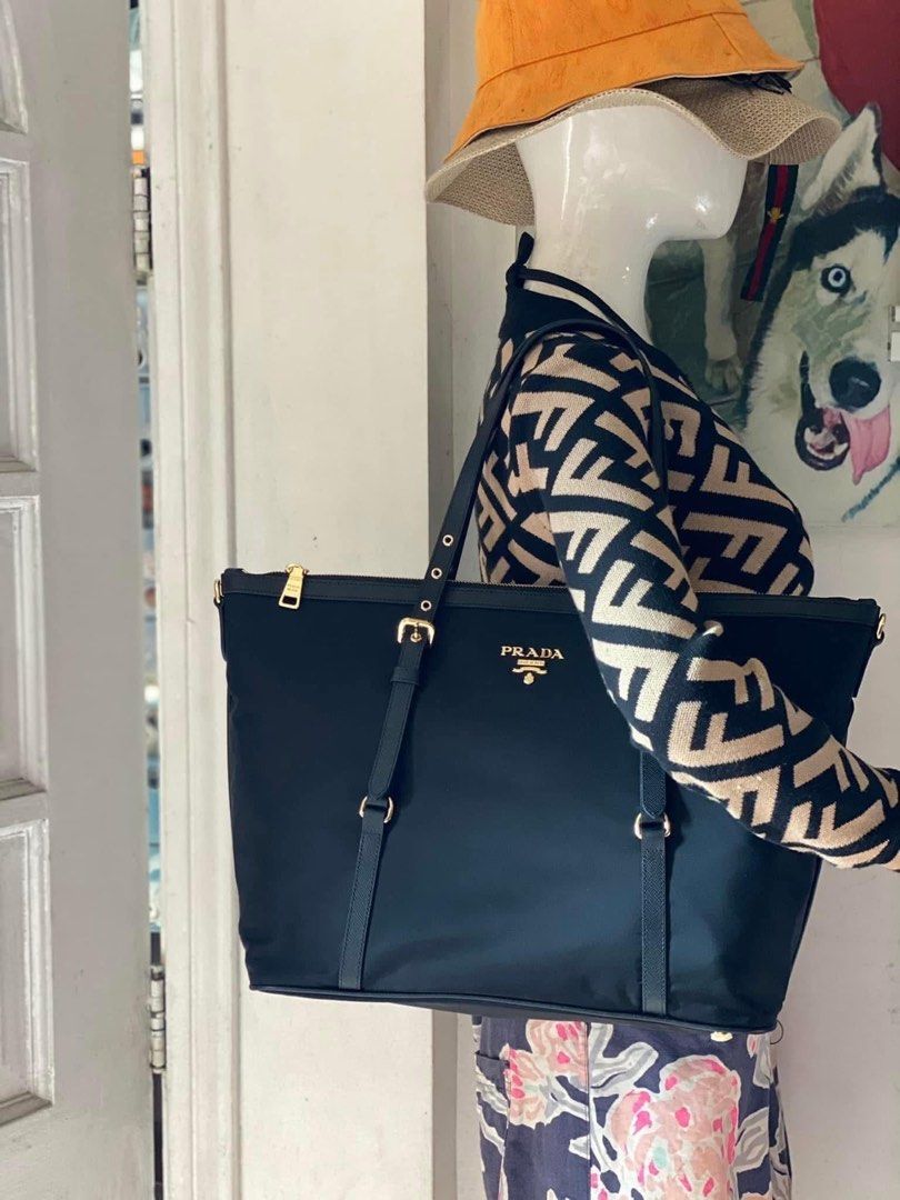 Preloved Prada Tessuto Nylon Saffiano Tote (Category: Luxury Bags & Wallets) located in Manila. Submitted by bagsandshoesmanymore (Listing ID 1372170624, Image 2). Description: Preloved Prada Tessuto Size L 14” x H 12” Good condition Rank SA JAPAN PRELOVED Lampo zipper Please read before you order 👉🏻❗️Payment first before shipping ❗️Cut off time of payment 11am sameday delivery ❗️NO MEET UP / NO PICK UP ❗️ORDER CANNOT BE CANCELLED ❗️PLEASE DON’