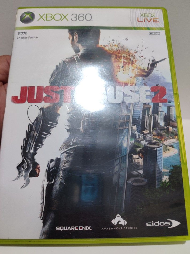 XBOX 360 - Just Cause 2 (PRE-OWNED) "OPEN REGION" (Category: Xbox) located in Mendez-Nunez. Submitted by sf2_gameshop (Listing ID 1372130655, Image 2). Description: PLEASE READ: Open region, the disc will work on any Xbox 360 units. PAL - √ (Yes) NTSC/J - √ (Yes) NTSC/UC - √ (Yes) CONDITION: Pre-owned item.Tested working. Please see posted photos for the disc condition. It comes with a game manual. GENRE: Action adventure MODE: Single-player REGI