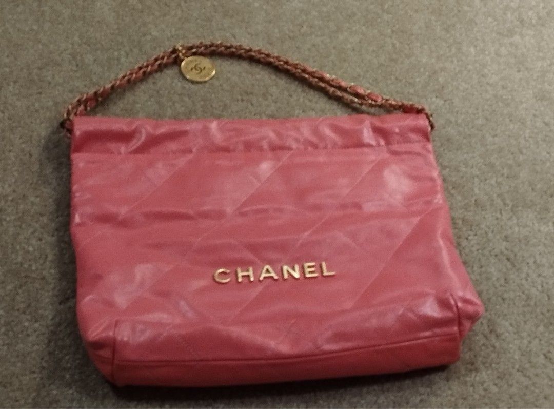 Chanel 22 (Category: Luxury Bags & Wallets) located in Makati City. Submitted by CleverKloset (Listing ID 1367107670, Image 2). Description: ACTUAL PHOTOS POSTED. ASKING OF MORE PHOTOS WILL BE IGNORED. Hobo bag of pink calfskin with gold tone hardware and has the diamond signature quilting. Includes removable pouch, dust bag and care card. Very good condition. The interior is lined in pink fabric with one zip pocket on the rear wall..