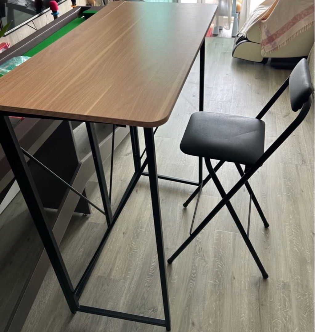 Foldable table (Category: Tables & Sets) located in Singapore. Submitted by rounded (Listing ID 1367191391, Image 1). Description: Fodable bar table + foldable chair 1.2M height, study table Great for bar table use, standing work and coffee table Clearing as making space due to light use Arrange own pick up .