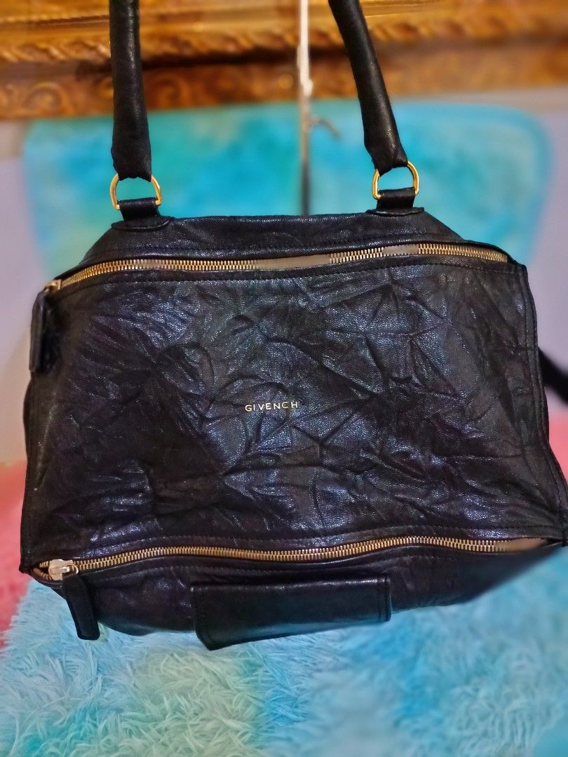 Givenchy Pandora (Category: Luxury Bags & Wallets) located in Santo Tomas. Submitted by mybellacloset158 (Listing ID 1367250889, Image 1). Description: Givenchy Pandora Soft Genuine Leather Large size Actual Photo posted *Issue missing letter" Y" that's why I selling it in a Low price, other than that the bag is still in good condition. Disclaimer: I am not affiliated, associated, authorized by, or in any way officially connected on the posted pr