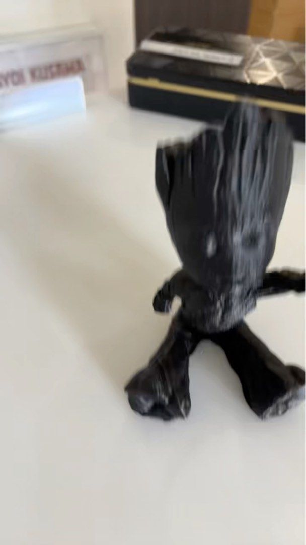Groot Figurine (Category: Toy Figures) located in Singapore. Submitted by lhsa91 (Listing ID 1367183421, Image 2). Description: This is a cute Groot figurine, perfect for any Marvel fan! It's in lightly used condition, with no scratches or defects. It's a great addition to any collection or desk. .