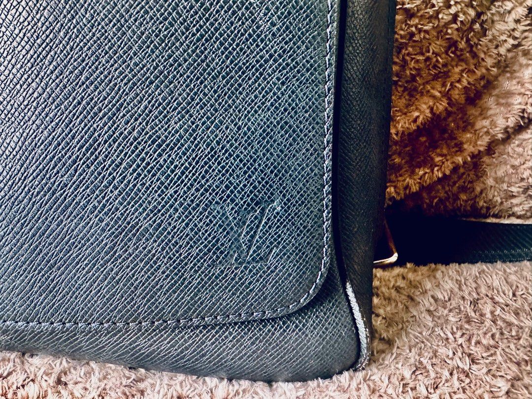 Louis Vuitton Blue Taiga Leather Bag (authentic) (Category: Bags & Wallets) located in Singapore. Submitted by BruceB (Listing ID 1367185618, Image 2). Description: Bought in MBS LV shop.Good condition as hardly worn. Has some light scratches from use however not cosmetically disturbing. Can provide more pics at request. Authenticity Guaranteed. New costs 2800$ Condition: 8/10 - minimal signs of wear with no stains or smell. Dimensions: 32 x 26 x
