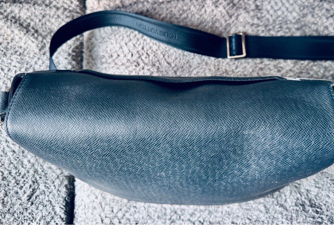 Louis Vuitton Blue Taiga Leather Bag (authentic) (Category: Bags & Wallets) located in Singapore. Submitted by BruceB (Listing ID 1367185618, Image 3). Description: Bought in MBS LV shop.Good condition as hardly worn. Has some light scratches from use however not cosmetically disturbing. Can provide more pics at request. Authenticity Guaranteed. New costs 2800$ Condition: 8/10 - minimal signs of wear with no stains or smell. Dimensions: 32 x 26 x