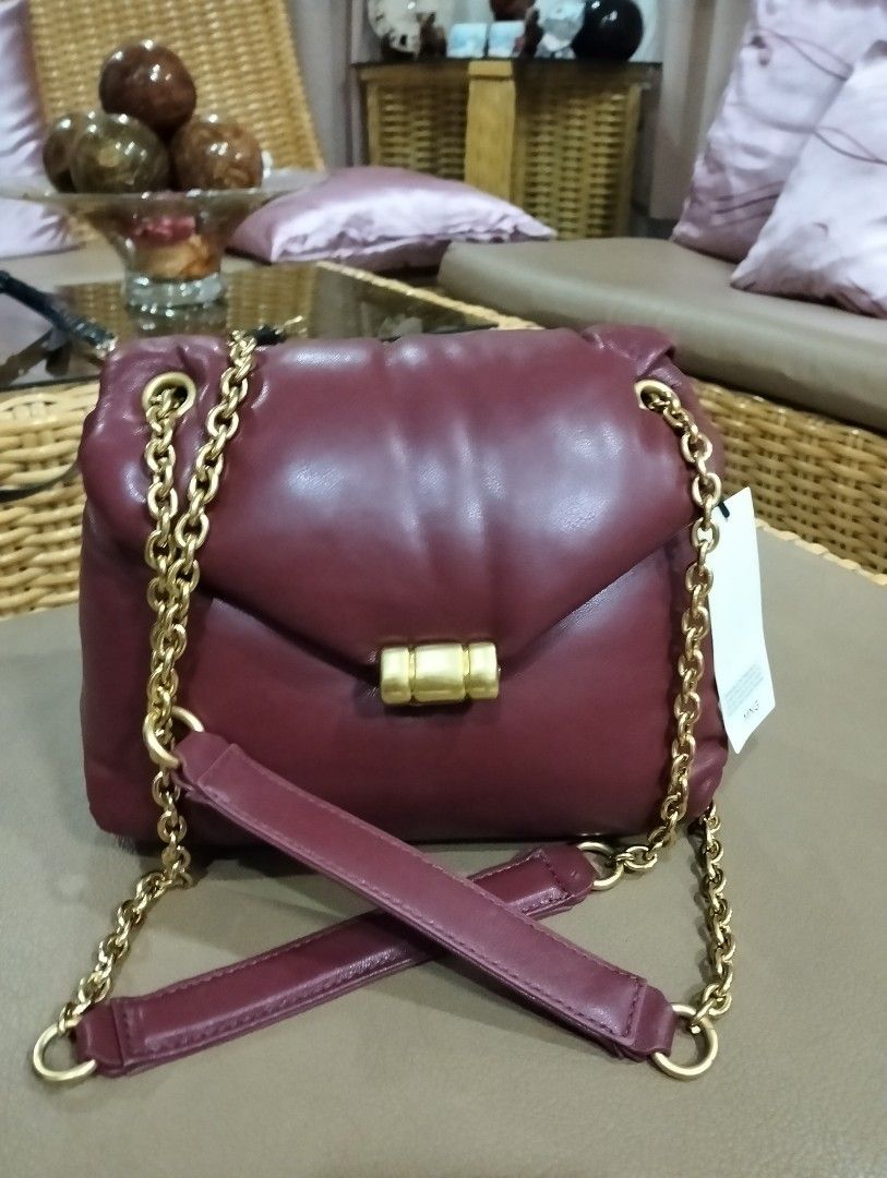 Mango Burgundy Chain Bag (Category: Luxury Bags & Wallets) located in Mandaue City. Submitted by goldenstorm.025d17 (Listing ID 1367235751, Image 1). Description: Reducing the price since there's a small peel off at the top part of the sling already. Never been used. PM me for inquiries. Thank you..