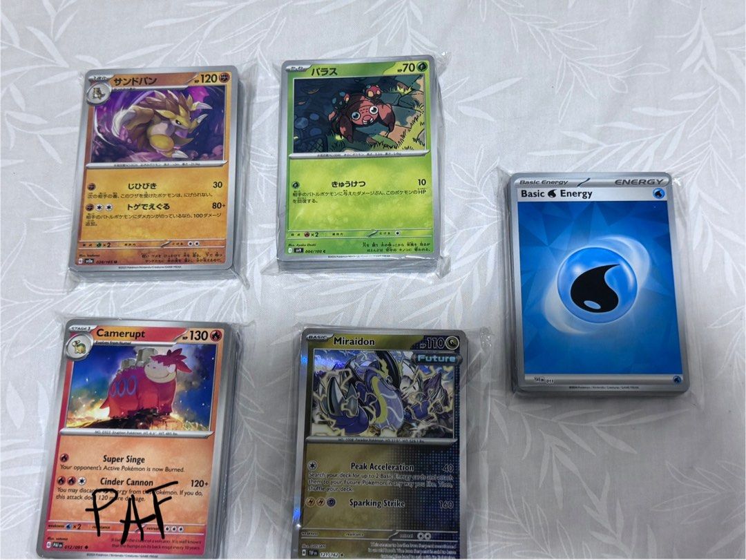 Pokemon TCG/Cards Bulk | 50 pcs. (Category: Raw Singles) located in Davao. Submitted by aemi.dvo (Listing ID 1367222742, Image 2). Description: All cards are NM-M RFS: decluttering, cards are taking too much space 😭 Mix of prismatic, obsidian flames, Journey together etc. PHOTO 1 50pcs bulk - 200 ea PHOTO 2 50pcs Jp bulk - 150 ea PAF bulk 43 pcs (w/ holos, rev holos) - 250 25 pcs holos - 200 38 pcs energy cards (w 4 holos) - 170 Photo 3 15 pcs r