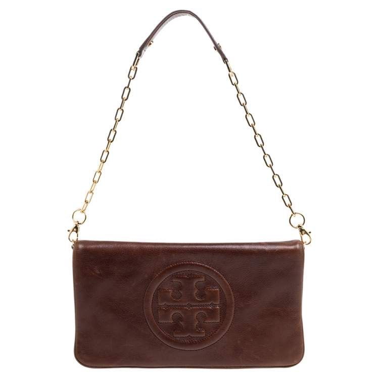 Authentic Tory Burch Bombe Reva Chain Clutch (Category: Luxury Bags & Wallets) located in Manila. Submitted by mokaaaaaaaa (Listing ID 1367472095, Image 1). Description: Authentic tory burch ‘Bombe Reva’ chain clutch in dark brown. There’s slight fading on the chain but barely noticeable! See last 2 pictures. Sobrang ganda ng leather mga sis 💯.